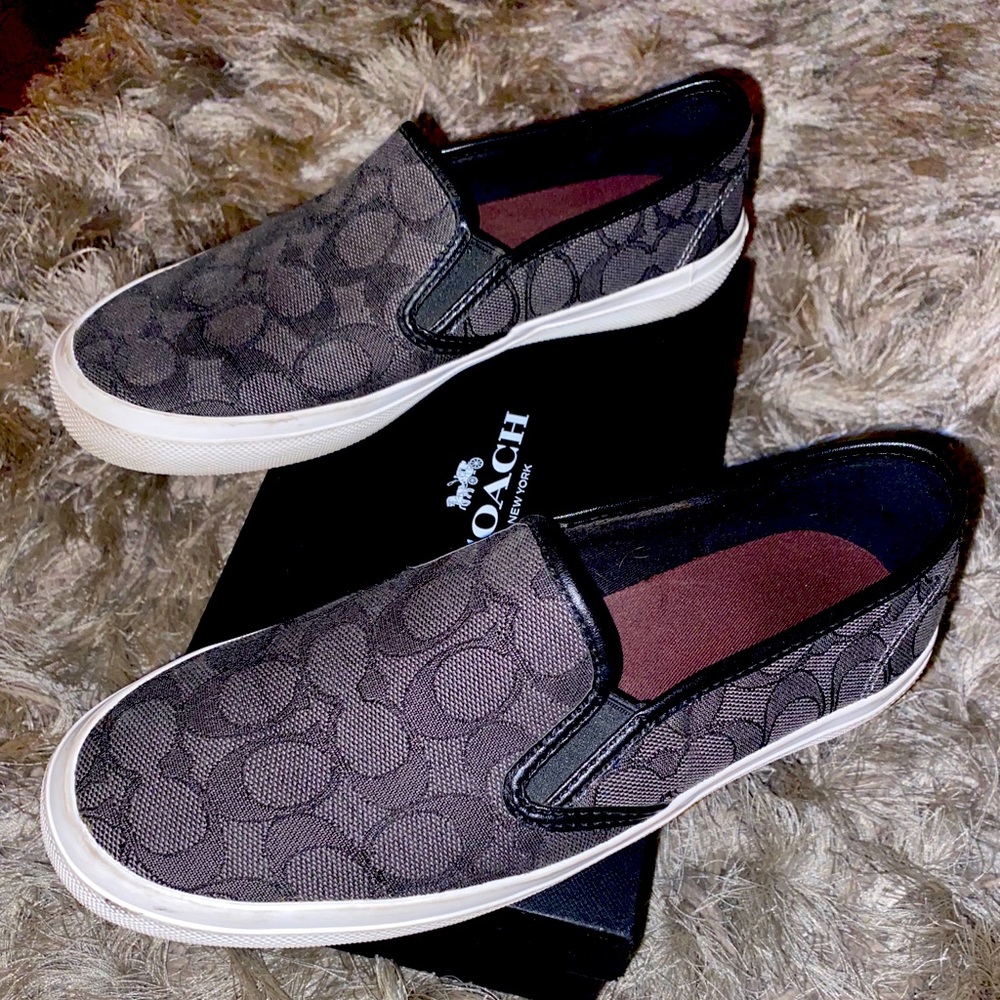 Black and gray Coach slip ons